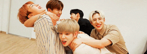 A.C.E hugging each other and waving